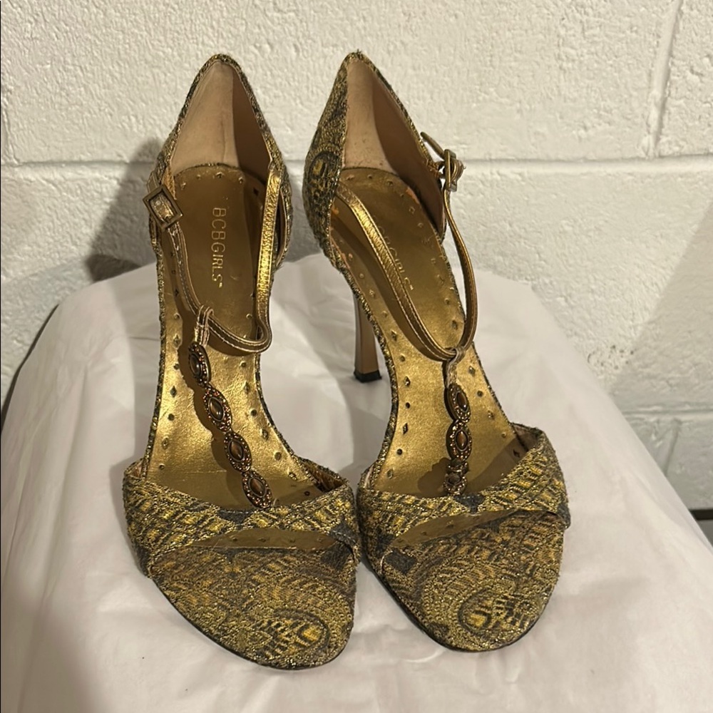 BCBGirls Gold T-Strap Heels with Metallic Finish
